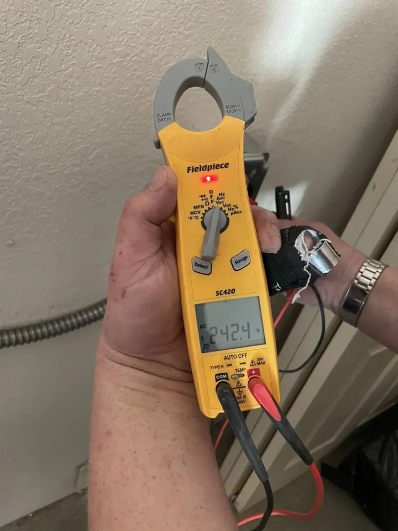 Voltage testing with clamp meter during Generator Installation in Pine City